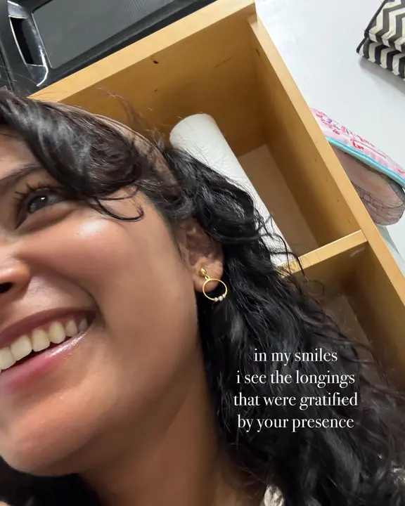 A laughing selfie with the lines: in my smiles i see the longings that were gratified by your presence